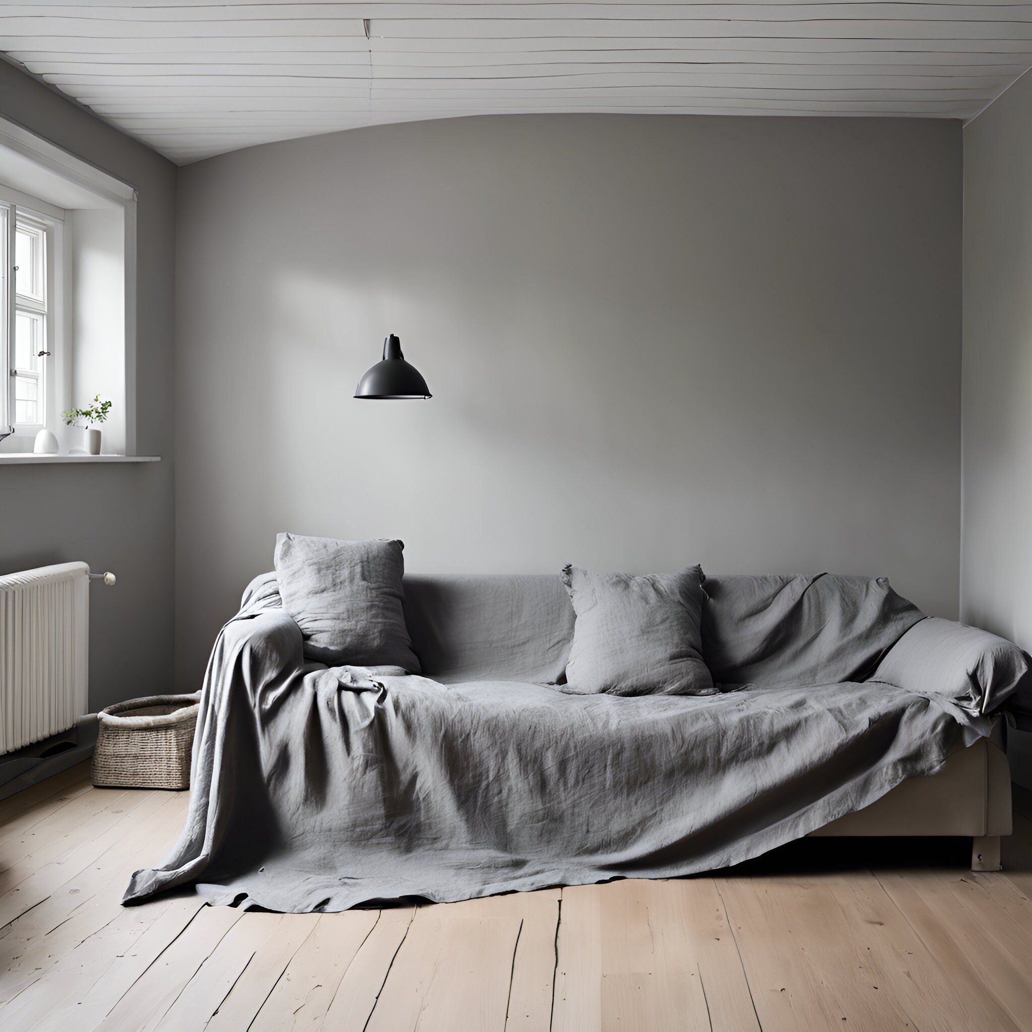 Grey linen cover for coush or sofa in scandinavian room
